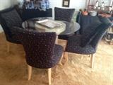 Stylish 80's Dining Set includes a Pedestal Glass Top Table, 4 Upholstered Chairs and 2 Matching oversize pillows