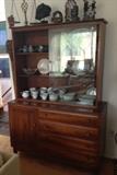 Gorgeous Willets Cabinet in the living room holds a variety of antiques and collectibles, including Limoges plates