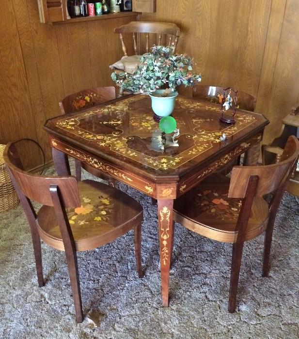 Very Nice (ornate) game table with 4 chairs  (Felt on other side of top, reverses to play games)