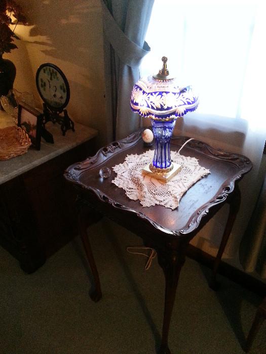 Antique table with cut glass lamp