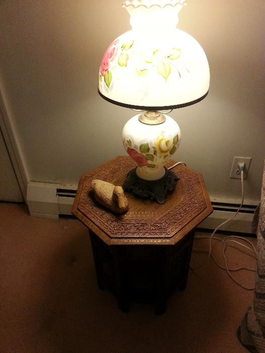 Carved table with lamp