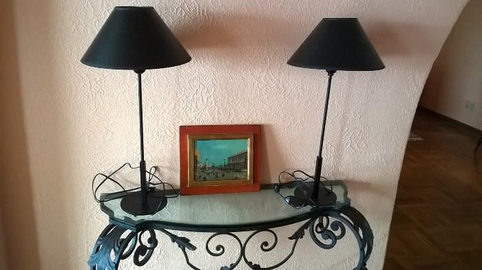 Wall mounted entry table with a pair of lamps