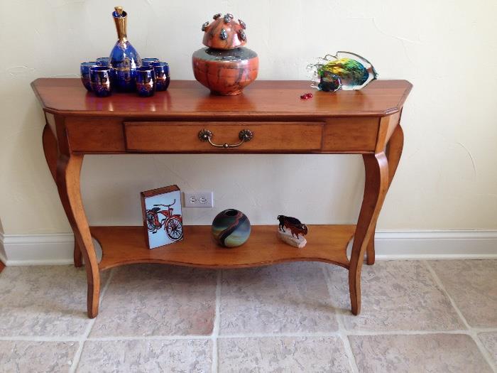 Wood entry table, ceramic art piece, Murano glass wine set, hand blown glass fish, hand blown glass vase