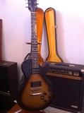 Gibson guitar with case and amp