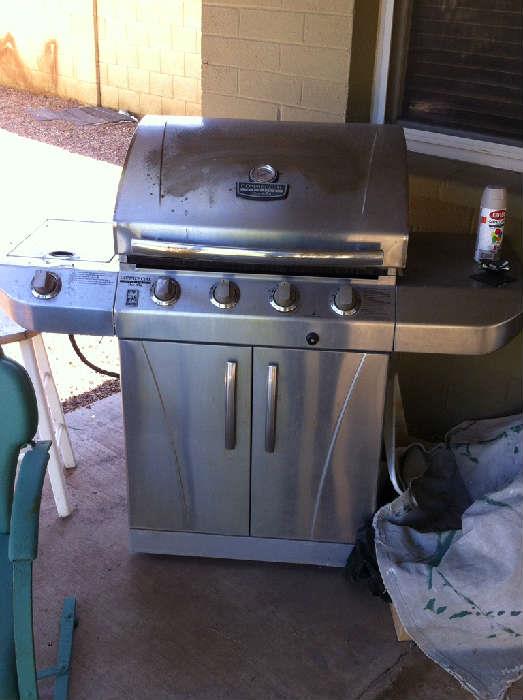Charbroil gas grill has 4 burners and a side burner