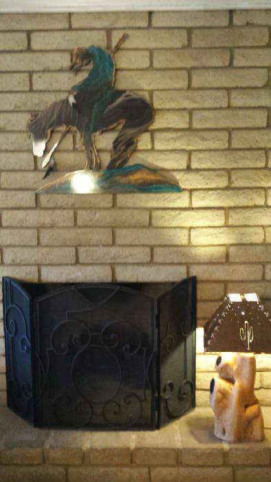 Metal cowboy art, fireplace screen, supercool tree stump lamp with metal shade (it's a heavy lamp!)