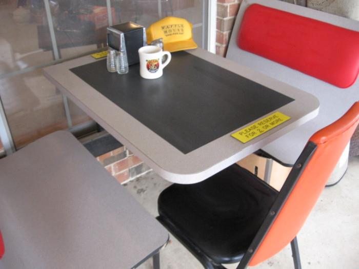 Authentic original waffle house table and seat, salt pepper and sugar dispenser, napkin holder, mug, and menus