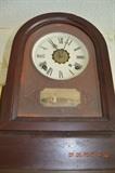 Mahongany case, glass front shelf clock 15"