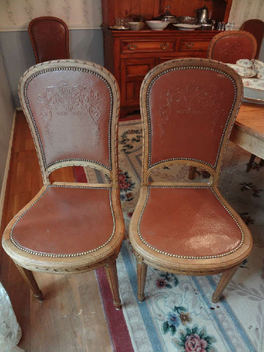 Set of 6 antique Louis XVI embossed leather chairs.  Great condition!!!!