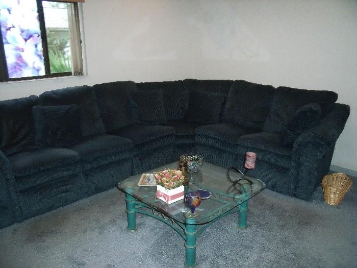 corner sectional with recliners at each end and glass top/metal base table