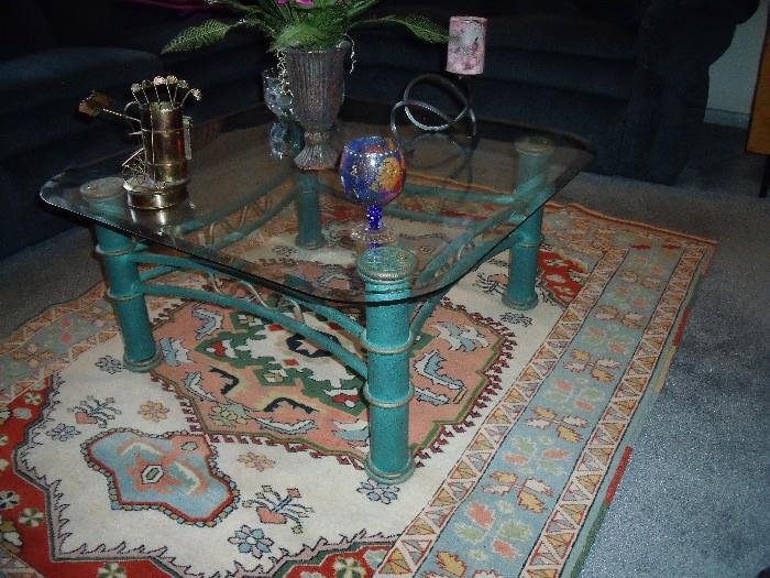 Metal/glass coffee table atop beautiful Kilim rug