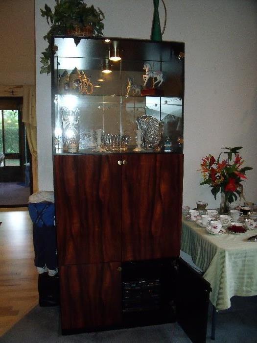One of two curio cabinets.  Can also be used for a bar or a media cabinet.  Lighted on top