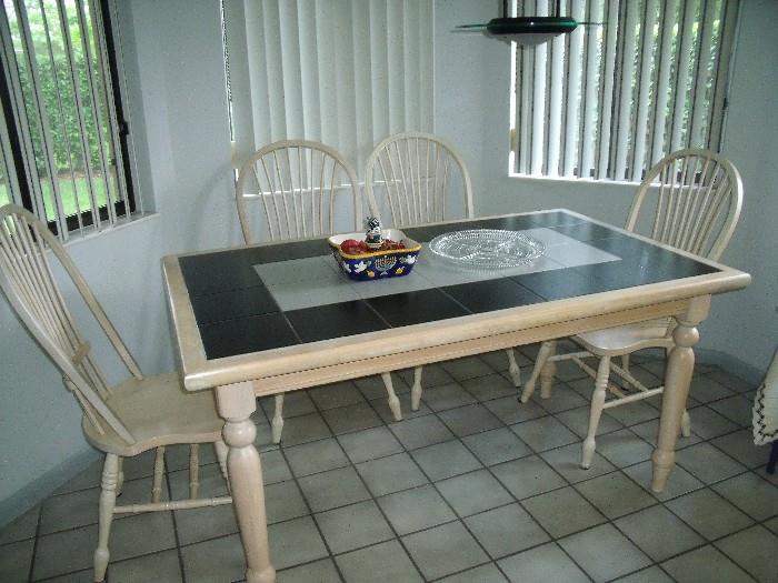 Dinette set with 4 chairs.  Tile top table