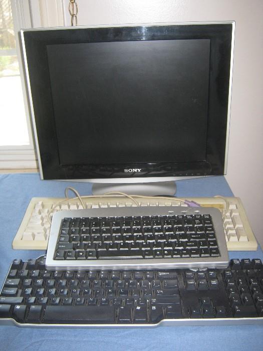 Sony computer monitor, HP, Dell, and Microsoft keyboards