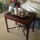Mahogany skirted Tea Table with silver service