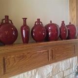 Assorted red pottery vases