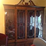 One of 2 matching mahogany breakfront display/china cabinets from Beacon Hill Furniture