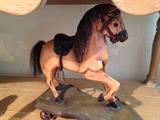 Antique hobby horse on wheels
