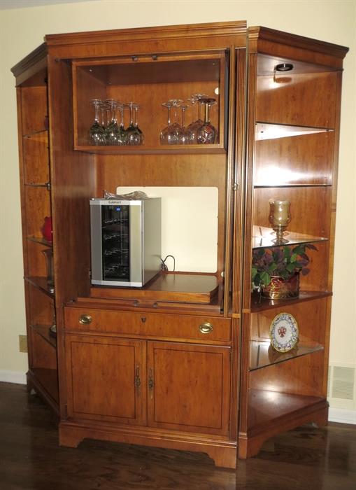 Yew wood from Europe. Three piece large cabinet/bookcase. Wine cooler is on shelf.