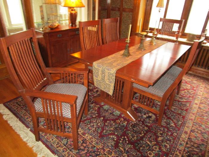 Beautiful Nichols & Stone (company owned by Stickley) dining table with four side chairs, two captain's chairs and three leaves.  Photo shown without leaves.