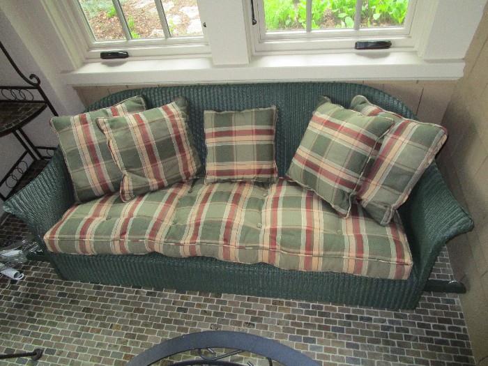 Hanging porch swing with cushions and pillows