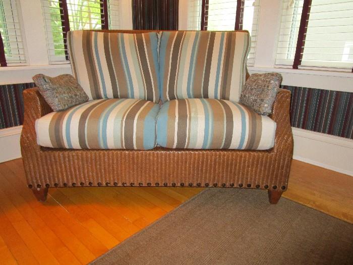 Detail shown on love seat without storage ottomans in front of it.  Down filled back cushions.  A very nice piece made by Excursions!