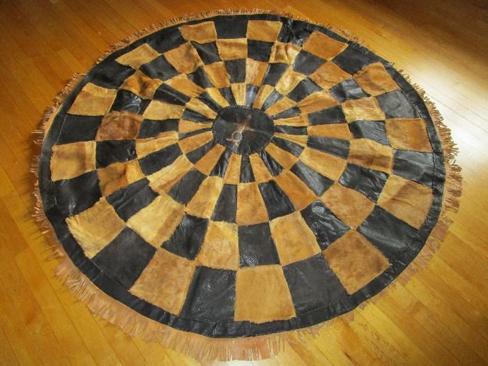 African leather, hide and snake skin round rug