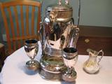 Tilting Water Pitcher,with original cups, porcelain lined,
Meridan & Co. No. 56,
Pat. 1868