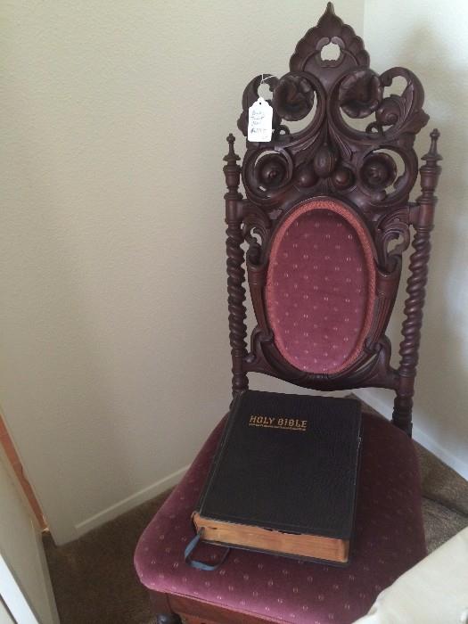      One of several antique chairs; very old Bible