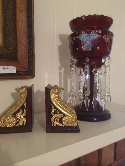      Gold bookends; one of two red mantel lusters