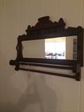          Antique mirror with towel/blanket rods