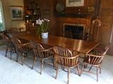 Country French cherry wood draw leaf table with an assembled set 10 of English yew wood Windsor chairs.