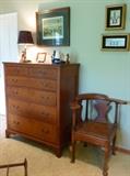 18th century mahogany chest of drawers and a robust corner chair.