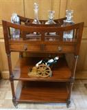 Edwardian liquor stand in mahogany.  Crystal decanters. 