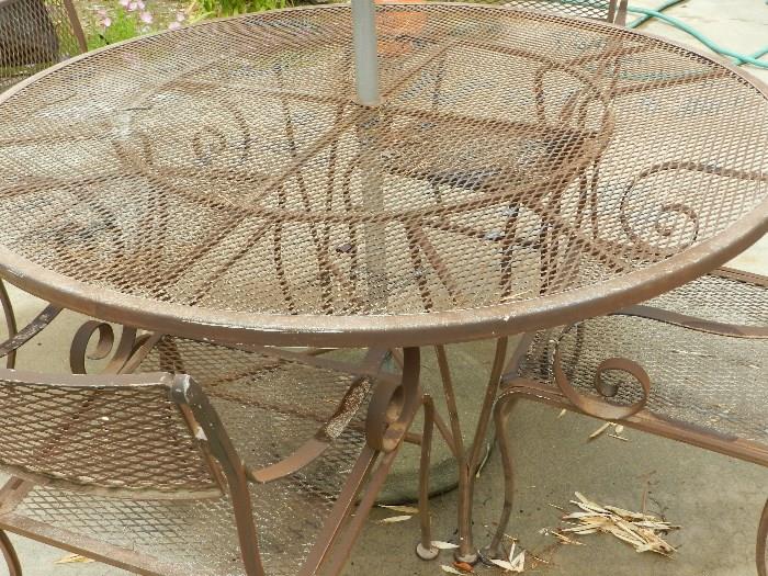 3 matching mid century wrought iron patio tables with 12 chairs ,