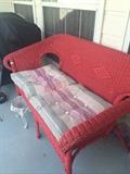                   Red wicker settee