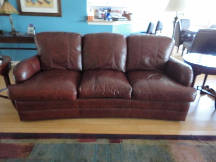 Leather Sofa has matching Chair and Ottoman 