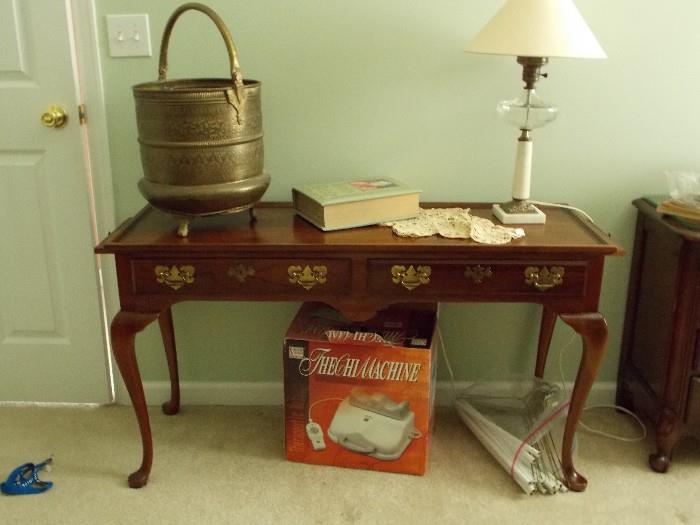 This sofa table has side pull out extenders on both sides. The brass bucket has wonderful engraved details.