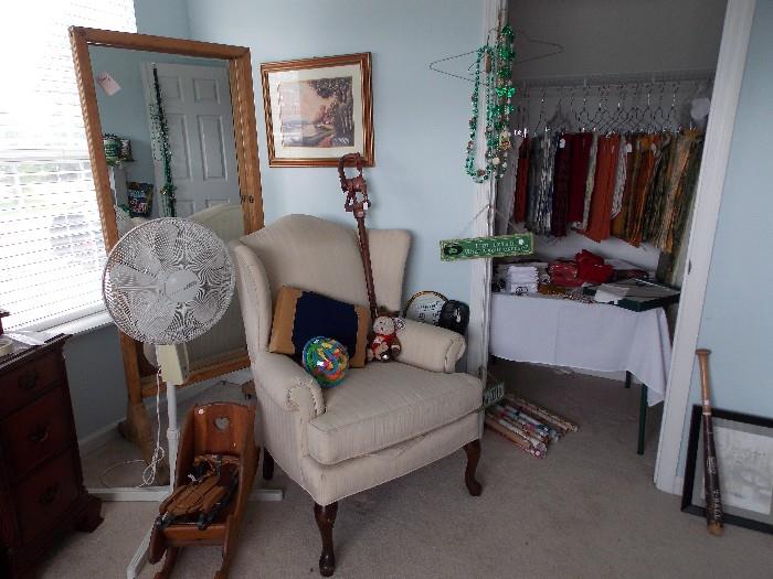 Large antique footed mirror, actual mirror is newer. Closet has napkin and placemat sets