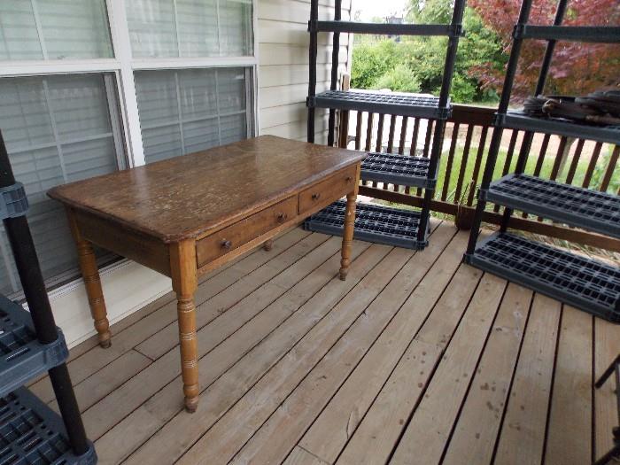 Old farm table with 2 drawers.