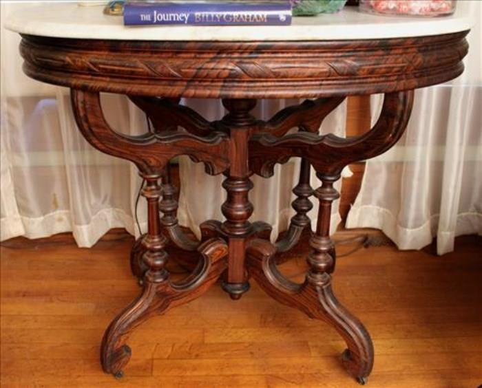 10 - Walnut Victorian marble top center table with rosewood grain, ca. 1860, original marble attr. to Mitchell and Rammelsberg , 30 in. T, 36 in. W, 25.5 D.