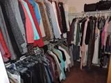 One of 2 closets full of clothing
