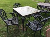 glass top wrought iron table with 4 chairs