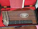 Rosewood Zither in original case and a Zither table
