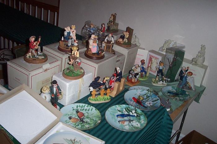 Rockwell figurines with boxes and paperwork