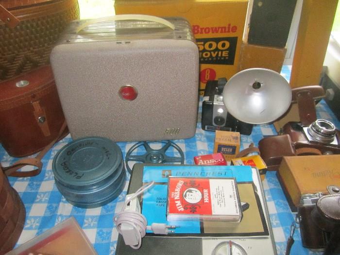 Brownie 500 movie reel projector, reels , slides ,Brownie camera with flash, Penncrest tape recorder, GE exposure meter