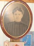 Close-up of Victorian Lady in oval wooden frame, antique it is!