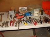 Assorted hand tools, pipe wrenches, hand drill, air pump, hammers, open and closed end wrenches, bread box, cigar box and more!