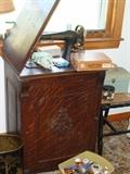 Gorgeous Golden Tiger Oak Sewing Cabinet with King Treadle Sewing Machine and attachements