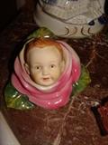Vintage porcelain flower with baby's head center